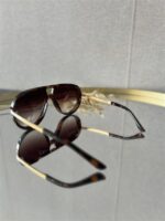 Zonnebril Golden Muse