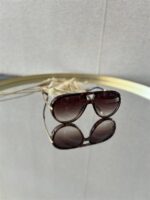 Zonnebril Golden Muse