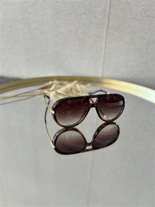 Zonnebril Golden Muse