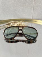 Zonnebril Golden Muse