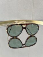 Zonnebril Golden Muse